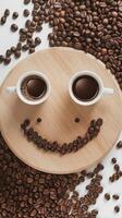 Coffee beans and two cups of coffee on a wooden plate with a smiley face photo