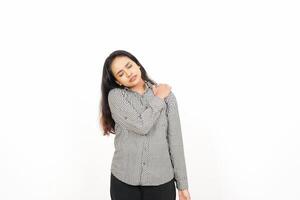 A woman is standing with her hands on her shoulders photo