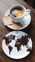 Coffee beans on a plate with a map of the world photo