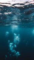 Underwater view of bubbles in the ocean photo