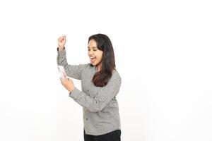 A woman holding a piece of paper and smiling photo