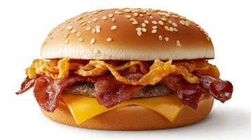 A hamburger with bacon and cheese on it photo