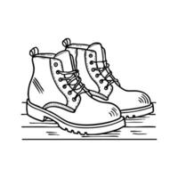 A pair of worn leather boots resting on a wooden floor vector