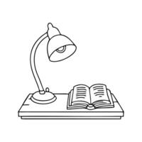 Antique table lamp with intricate details, sitting on a wooden desk with an open book vector