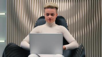 Caucasian woman girl in white neon futuristic space female IT programmer hacker coder gamer hacker software computer tech support typing laptop addict modern virtual reality play online game metaverse photo