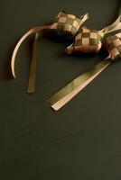two bows tied to a green and brown cloth photo
