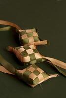 three small squares of fabric with ribbons tied to them photo