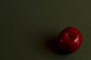 a red apple on a green surface eid photo
