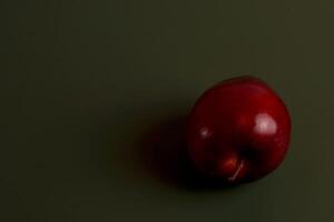a red apple on a table eid chinese photo