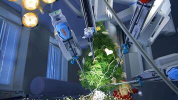 Machine arm surgeon in futuristic operation room decorating pine-tree. Robotic arms put a paper snowflake on the Christmas tree. video