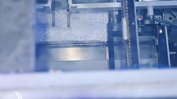 Mechanism for the formation of diaper pack. The final stages of diaper manufacturing at the factory. View from above. video