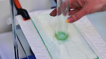 Production of diapers laboratory. Testing the absorbing abilities of diaper layers at the enterprise. Close up. video