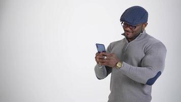 Businessman Using Mobile Phone. Portrait of handsome afro man using mobile phone video
