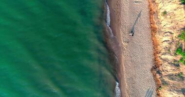 Sea waves crashing on beach. Aerial top view of sea waves break on beach video