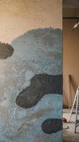 Texture concrete wall with a pnted layer of plaster and pnt blue gray black abstract background photo