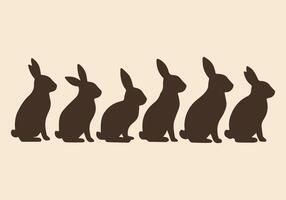 Silhouette of Five Rabbits Sitting in a Row vector