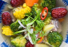 Vietnamese soup with beef vegetables and goji berries. photo