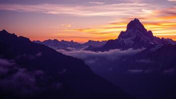 Mountains at sunset with clouds and mountains in the background photo
