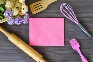 Kitchen utensils for bakery with space for text on a wooden table photo