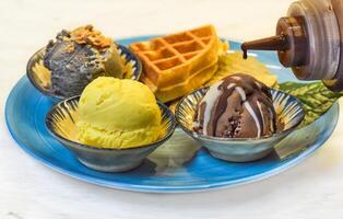 Homemade ice cream with waffle on the plate photo