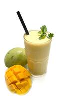 Mango lassi with sliced fresh mango isolated on white background photo