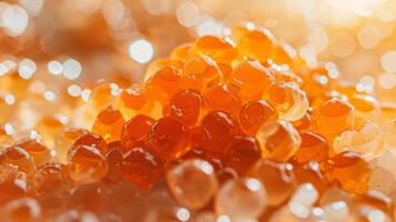 A collection of shiny orange droplets is scattered across a surface, reflecting light and creating a visually appealing texture, ideal for gourmet dishes or artistic food styling. photo