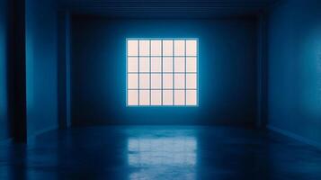 Illuminated window with a grid pattern set in a dark blue room with smooth reflective floor casting faint light into the space. photo
