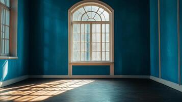 Sunlight streams through a window illuminating an empty room, highlighting its tranquil, peaceful ambiance with soothing blue walls. photo
