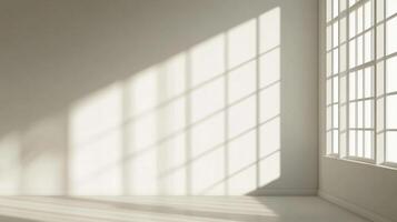Sunlight casts geometric shadows on a pristine white wall from a large grid window, creating a bright and minimalist interior space. photo