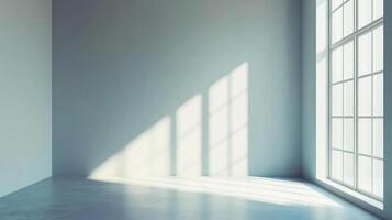 Bright sunlight streams through a large window, illuminating the corner of an empty room, casting abstract shadows and highlighting space. photo
