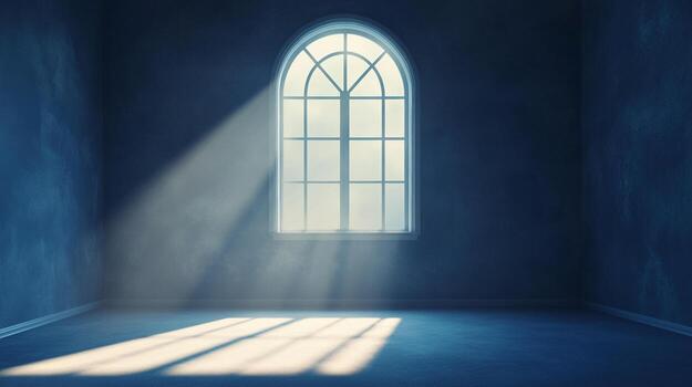 Sunlight streams through a window illuminating a dark, blue room with a serene and ethereal glow. An empty space bathed in light. photo