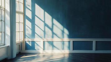 Sunlight patterns cast on a wall, illuminating the architectural details of a classic room with wainscoting and wooden floor. photo