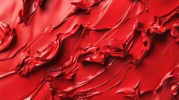 An abstract artwork featuring vibrant red paint swirling dynamically, creating a bold visual experience that captures the viewer's attention with its energetic motion. photo