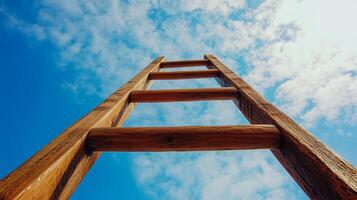 Ladder reaching towards a vibrant blue sky with scattered clouds, symbolizing aspiration, growth, and progress. Upward journey concept. photo