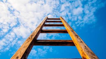 Ladder reaching into a vibrant blue sky with scattered clouds, symbolizing opportunity, growth, and aspiration towards a brighter future. photo