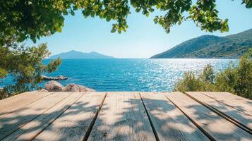 Seaside vista showcases a wooden dock overlooking a calm ocean, framed by foliage and distant mountains under a clear blue sky. photo