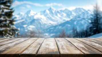 Scenic winter landscape featuring a rustic wooden table in the foreground and snow-capped mountains in the background creates a serene winter scene. photo