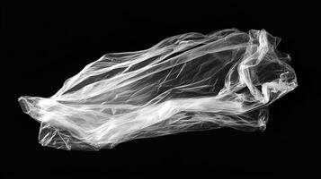 Translucent abstract form on black background with dynamic shadows and subtle textures, creating ethereal composition and visual interest. photo