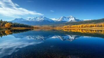 Sawtooth Mountains reflecting in a lake during fall foliage photo