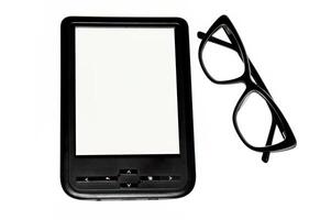 E-book and black glasses isolated on white background photo