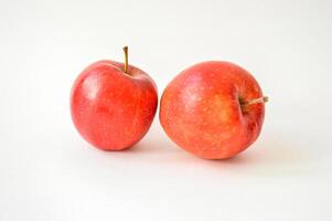 Large appetizing red apples isolated on white background photo