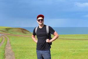 Russian tourist on the path of the Cape Kharantsy in Olkhon island, Russia photo