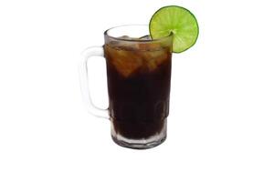 Mexican drink Charro Negro made of tequila and soda with lime isolated on white background photo