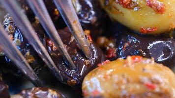 Discovering flavorful olives with spices and herbs at the local market video