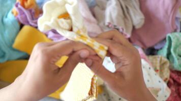Display of handmade yellow checked sweater during crafting session video