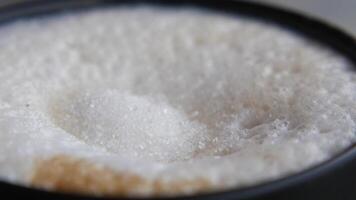Adding sugar to a cappuccino video