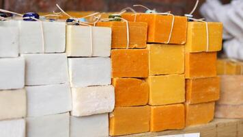 Natural soap bars in various colors displayed at local market video