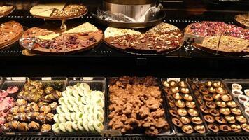 Delicious array of desserts displayed in a local bakery video