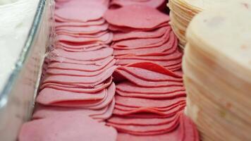 Different types of deli meats displayed at a market video
