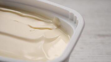 Butter spread in container on a table video